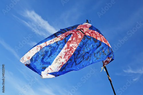 Foto Blood stained torn scottish flag