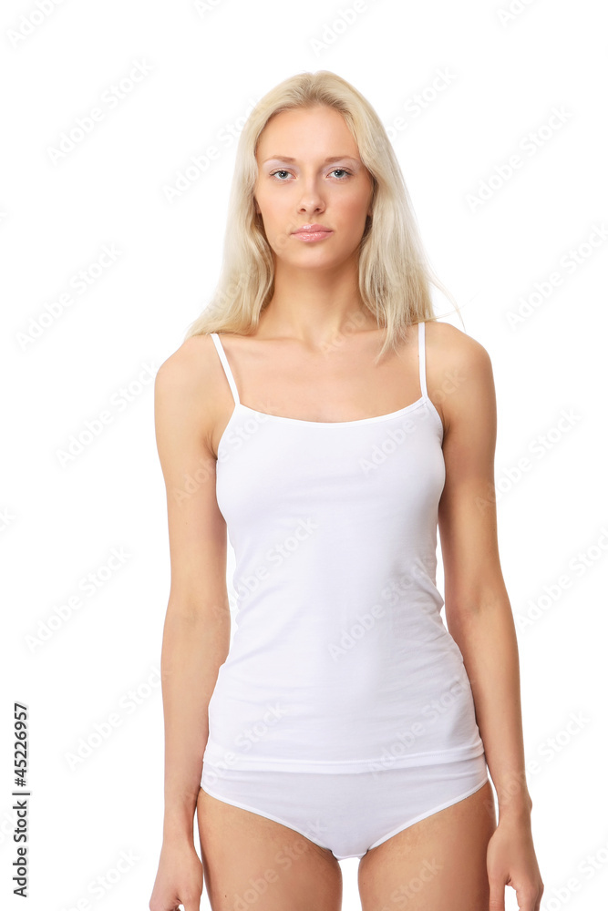 A young beautiful woman standing in underwear A young beautiful woman standing in underwear