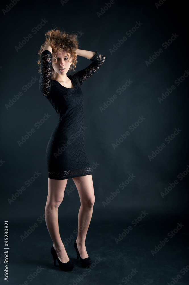 Portrait of beautiful curly girl with black lace dress