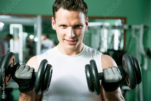 Man with weight training equipment