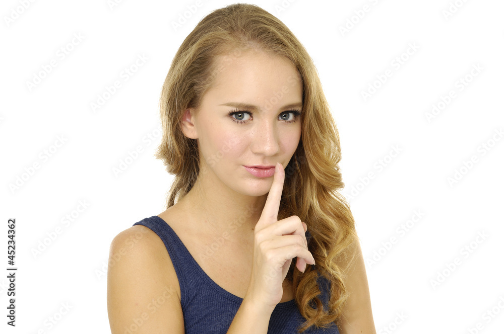 portrait of blond girl asking to keep quiet-isolated portrait of blond girl asking to keep quiet-isolated