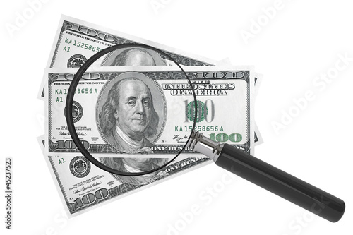 Dollars and Magnifying glass