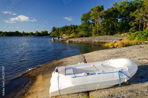White pontoon on Swedish summer sea coast