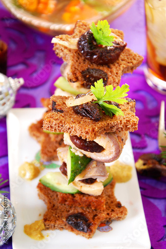 herring canapes with prune and gherkin for christmas