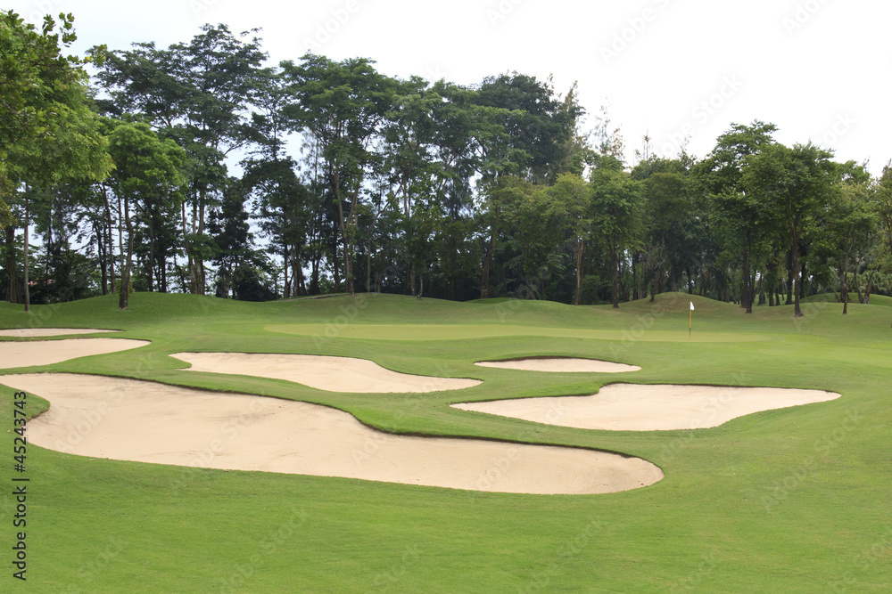 view of golf course showing green area protected by sand bunkers view of golf course showing green area protected by sand bunkers