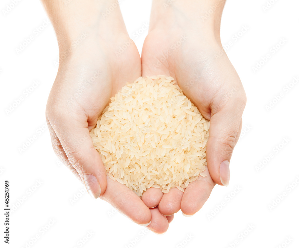 Hands with heap of rice isolated on white background Hands with heap of rice isolated on white background