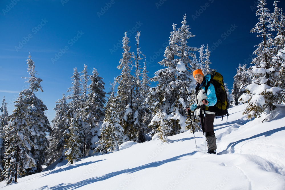 Hiker in winter mountains