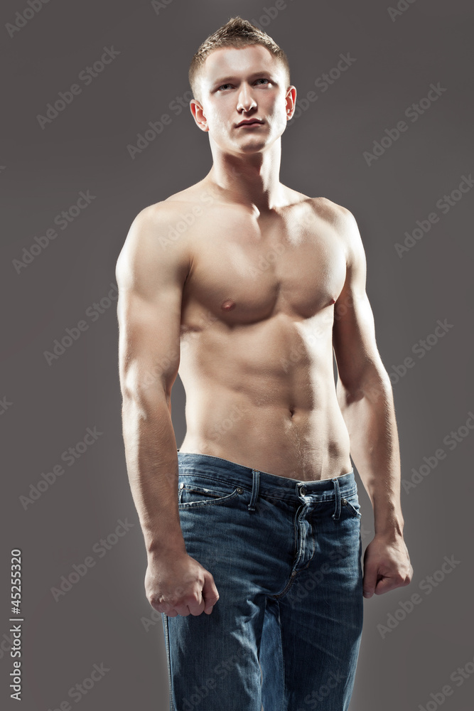 Muscular man posing shirtless Muscular man posing shirtless
