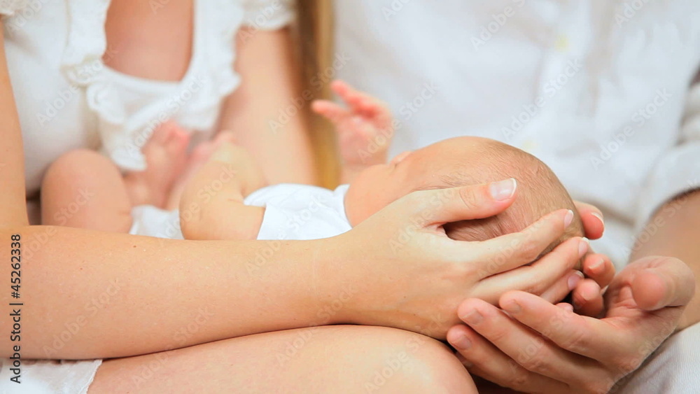 Close Up Parents Cradling Newborn Daughter Close Up Parents Cradling Newborn Daughter