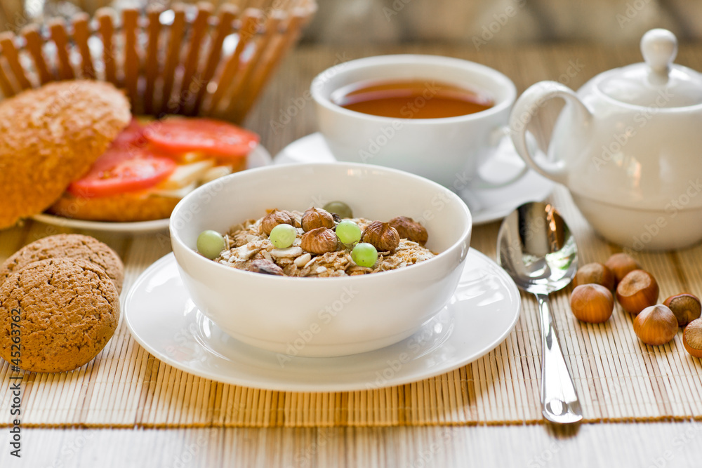 light breakfast with tea, fruit, sandwich and porridge light breakfast with tea, fruit, sandwich and porridge