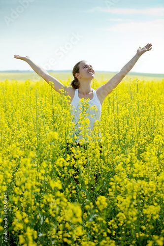Woman in rapeseed field