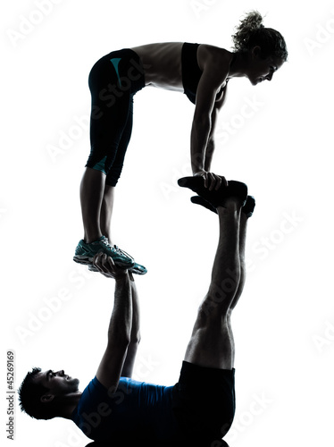 man woman exercising acrobatic workout fitness