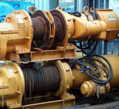 Two Large Yellow Winches