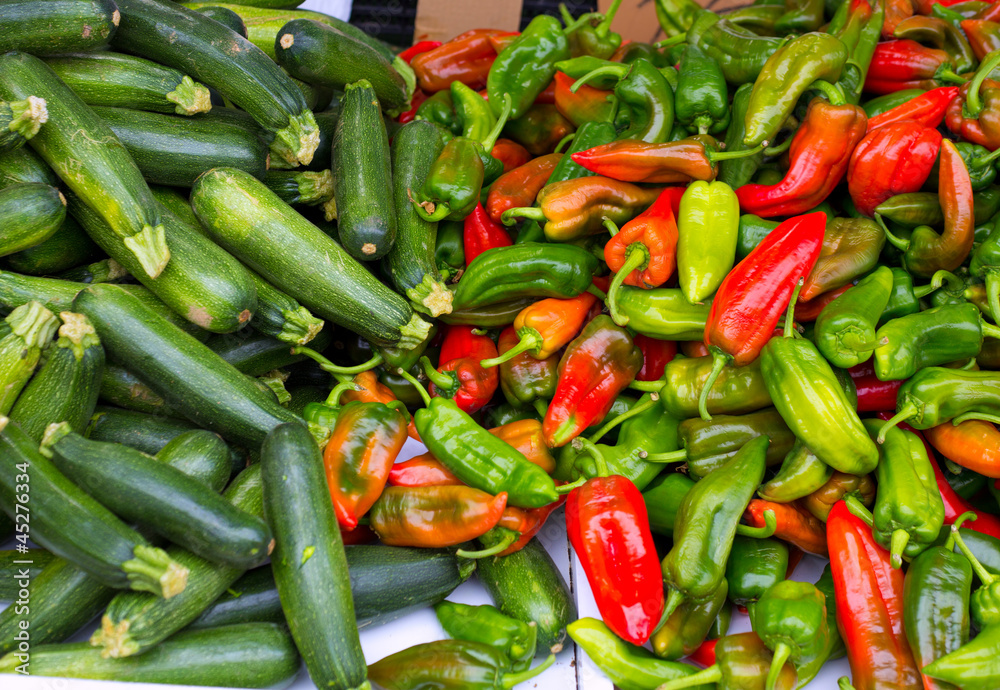 Colorful green and red peppers and zucchini