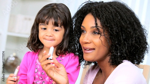 Pretty Ethnic Mom Daughter Using Cosmetics
