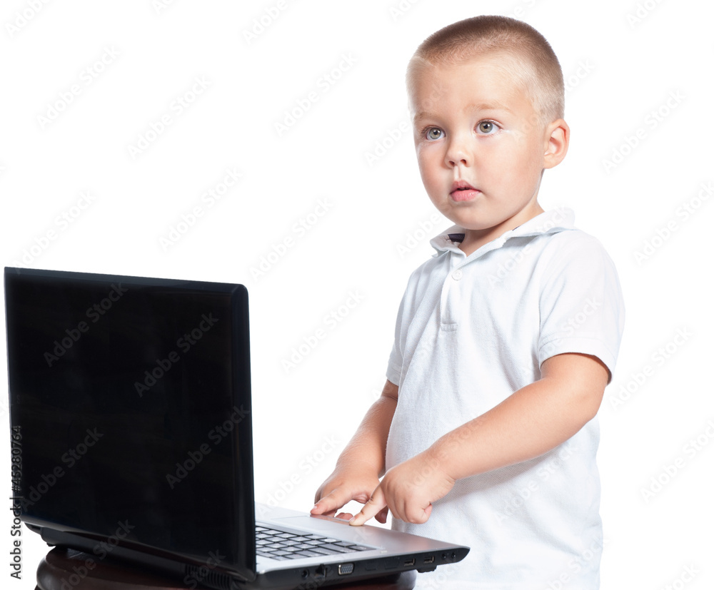 3-4 years old boy touching a button on laptop isolated over whit 3-4 years old boy touching a button on laptop isolated over whit