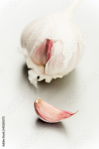 Close up of purple garlic bulb and clove