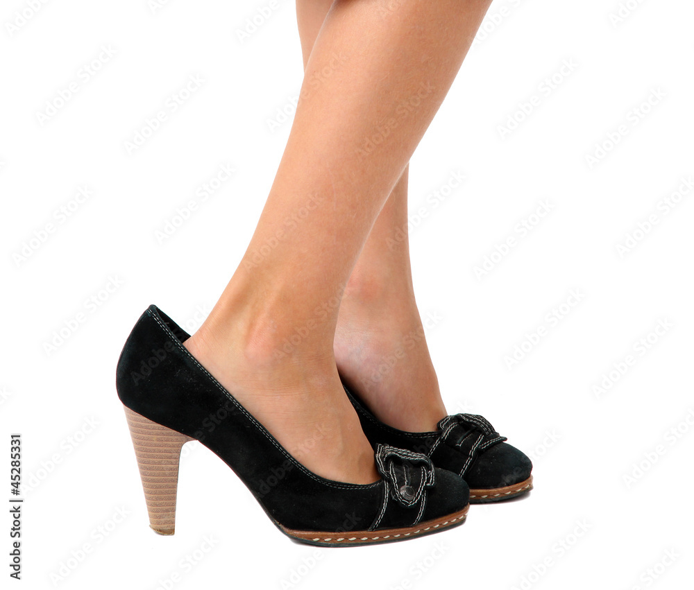 little legs in mommy's shoes, isolated on white little legs in mommy's shoes, isolated on white