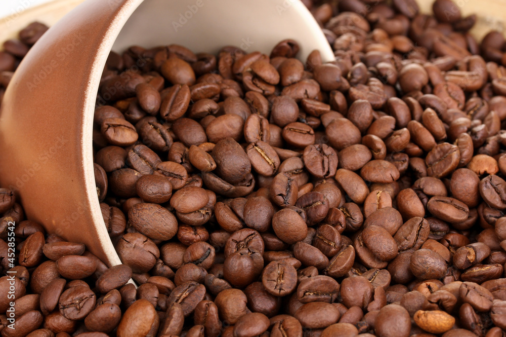 Coffee beans and cup close-up