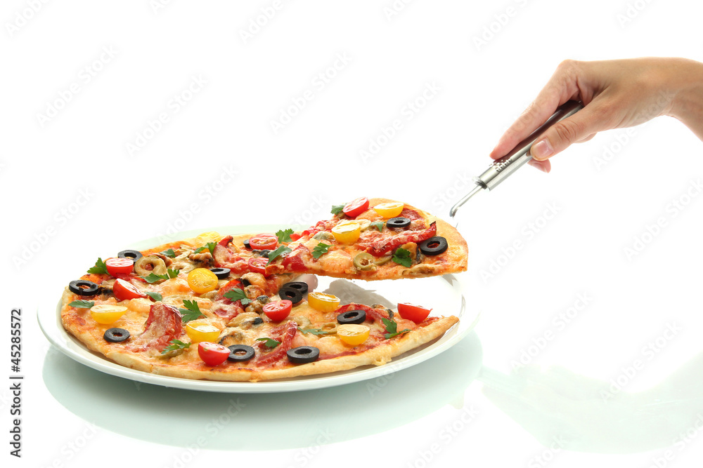 woman's hand holding a slice of pizza