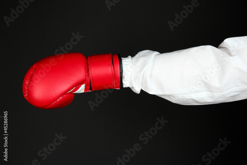 hand in boxing glove isolated on black © Africa Studio