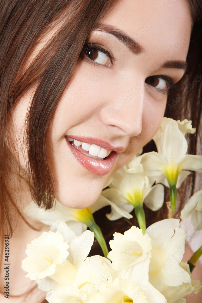 beautiful teen girl smiling and with flower narcissus and lookin beautiful teen girl smiling and with flower narcissus and lookin