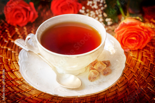 cup of tea with roses in vintage style