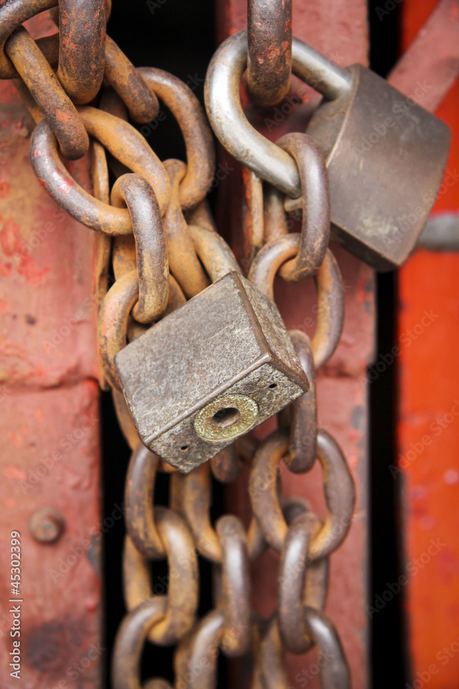 old rusty metal padlocks on chains old rusty metal padlocks on chains