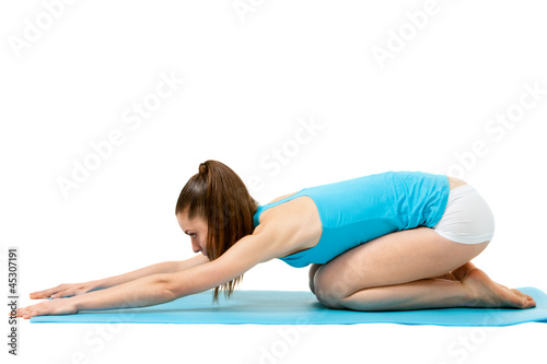 Fit girl doing body stretch.