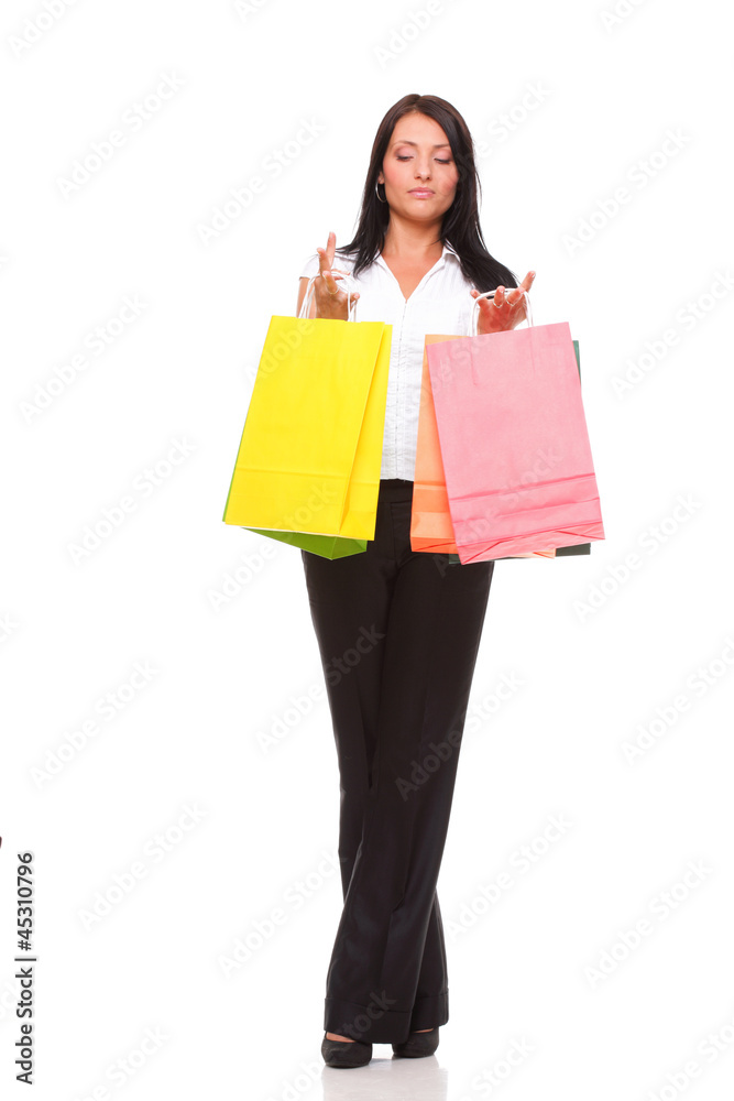 Full body portrait cheerful businesswoman holding shopping bags Full body portrait cheerful businesswoman holding shopping bags