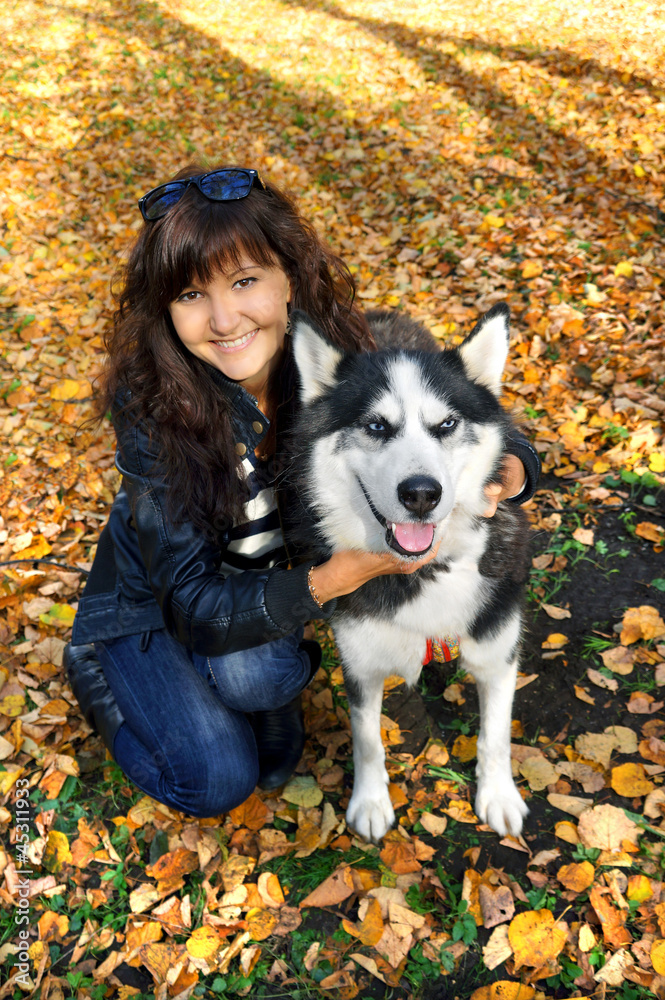 Dog siberian husky and young woman