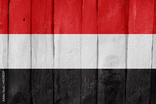 Flag of Yemen painted on a wooden fence