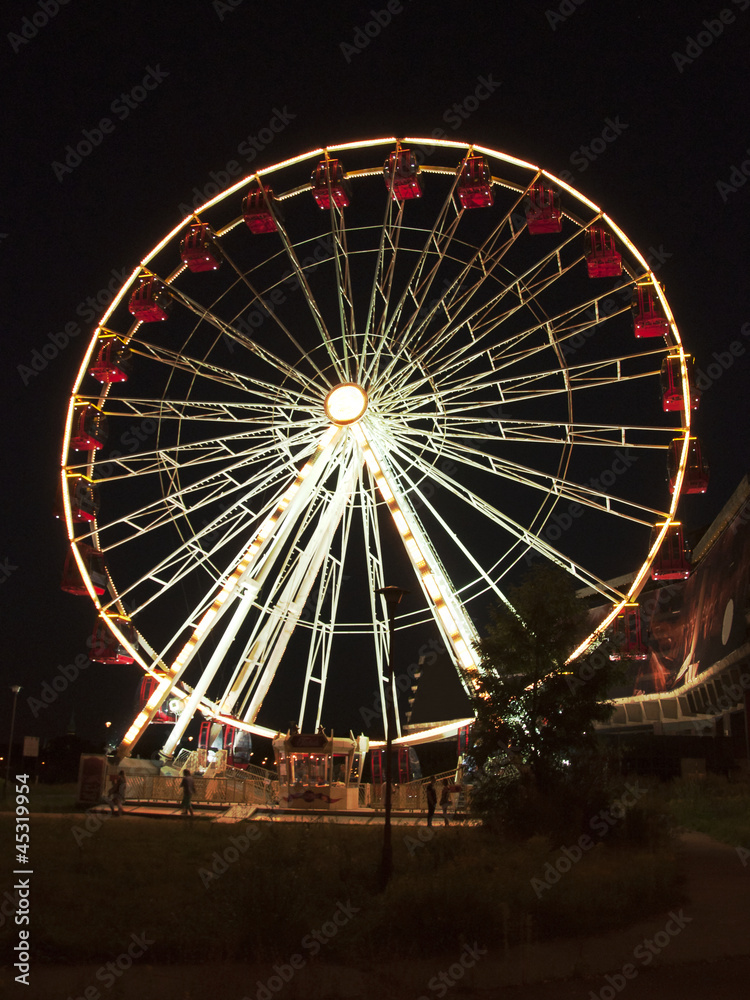 Illuminated Ferris wheel at night Illuminated Ferris wheel at night