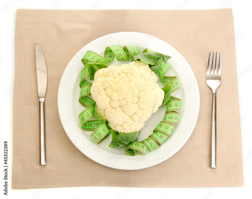 Fresh cauliflower and measuring tape Fresh cauliflower and measuring tape