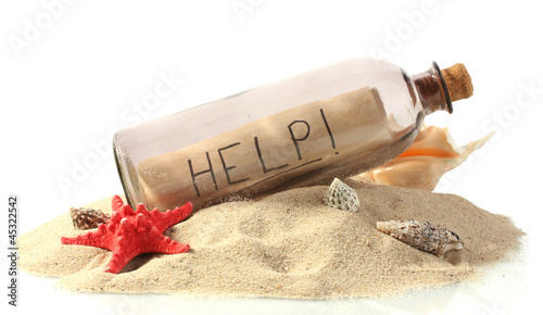 Glass bottle with note inside on sand isolated on white