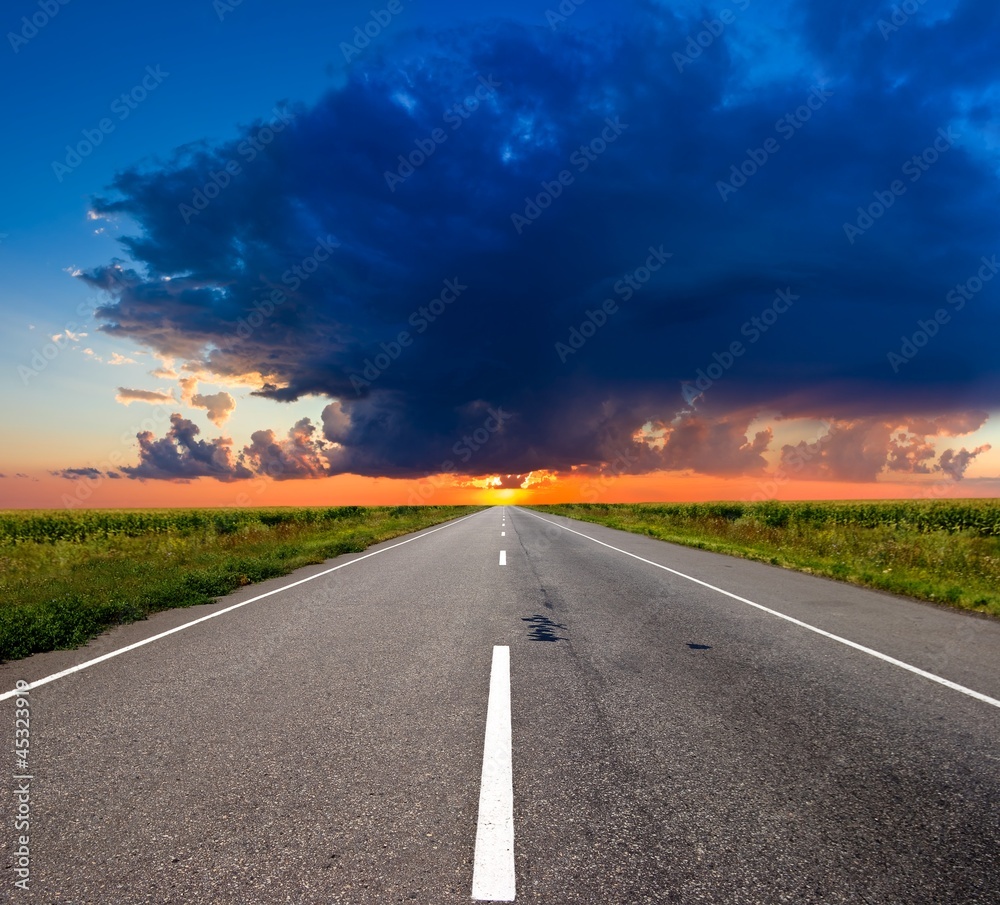 asphalt road to a sunset asphalt road to a sunset