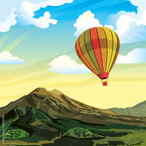 Summer mountain landscape with aerostat