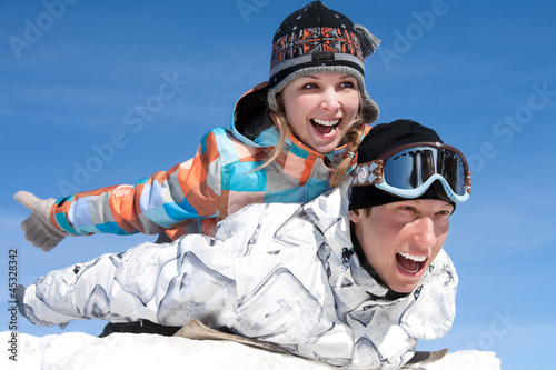 Couple play in snow