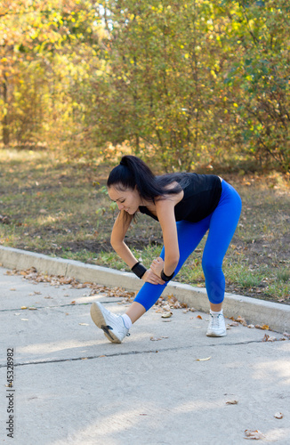 фотографія Fit woman limbering up