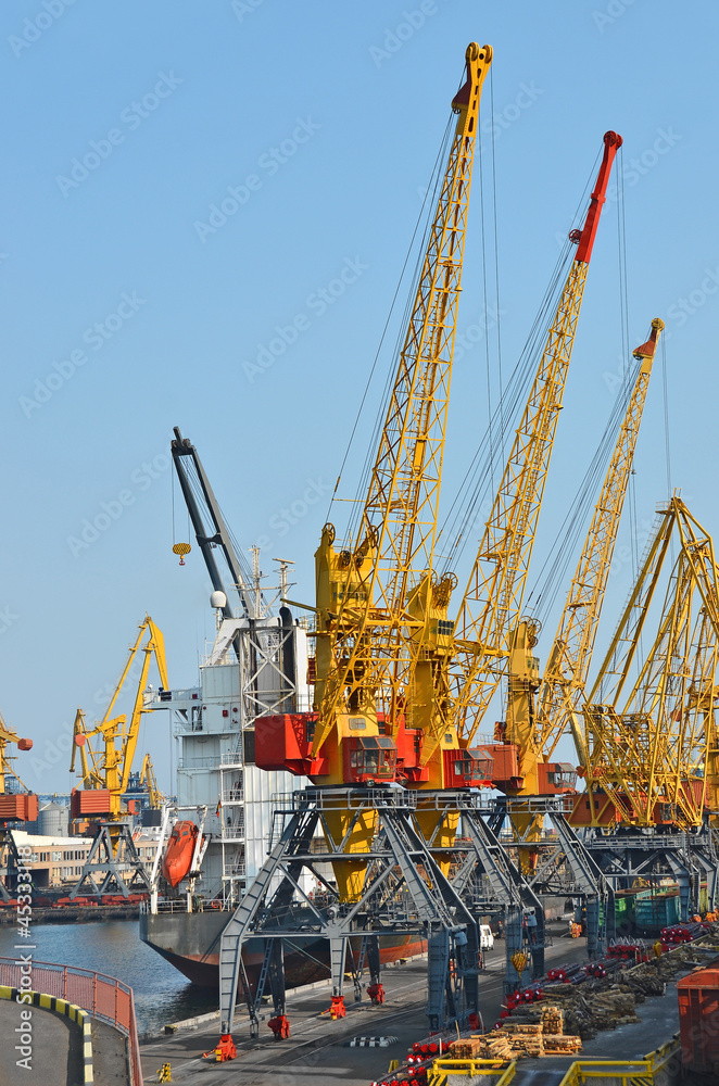 Pipe stack and ship under crane bridge
