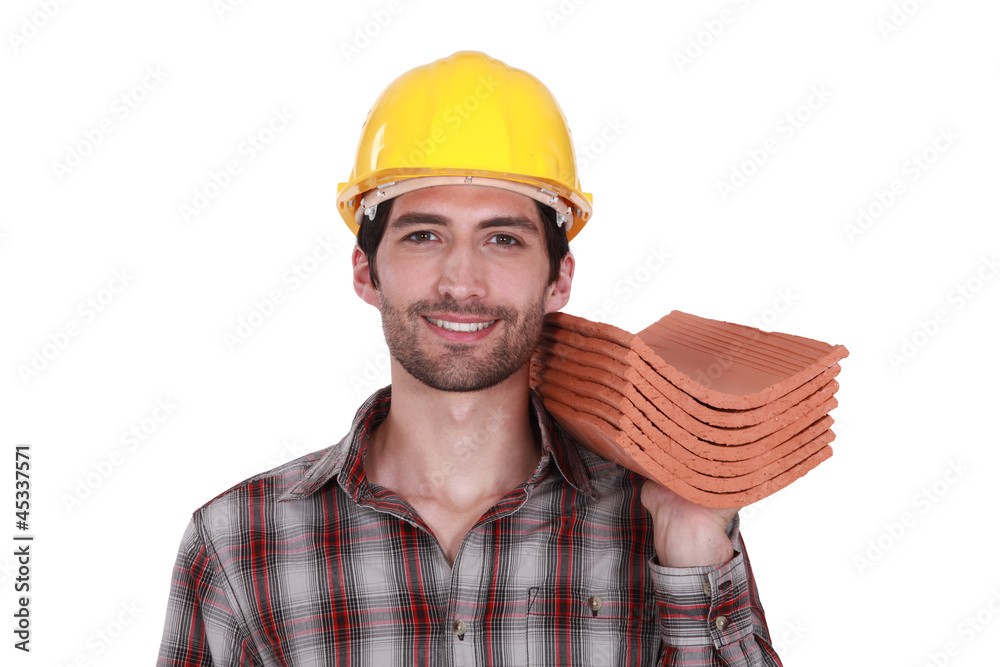 craftsman holding roof tiles craftsman holding roof tiles