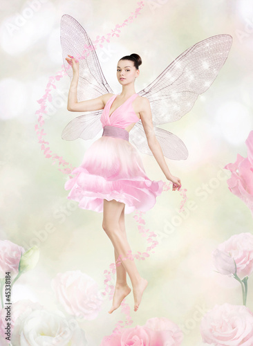Gorgeous young woman as flower fairy