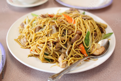 Plate of stir-fried chow mein at a Chinese restaurant. photo