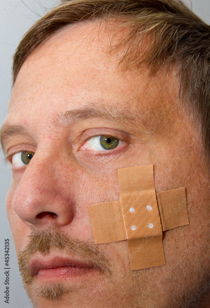 Pflaster im Gesicht – Stock-Foto | Adobe Stock