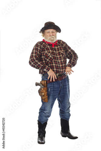Old West cowboy stands with thumbs in belt