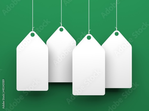 White tags on green background