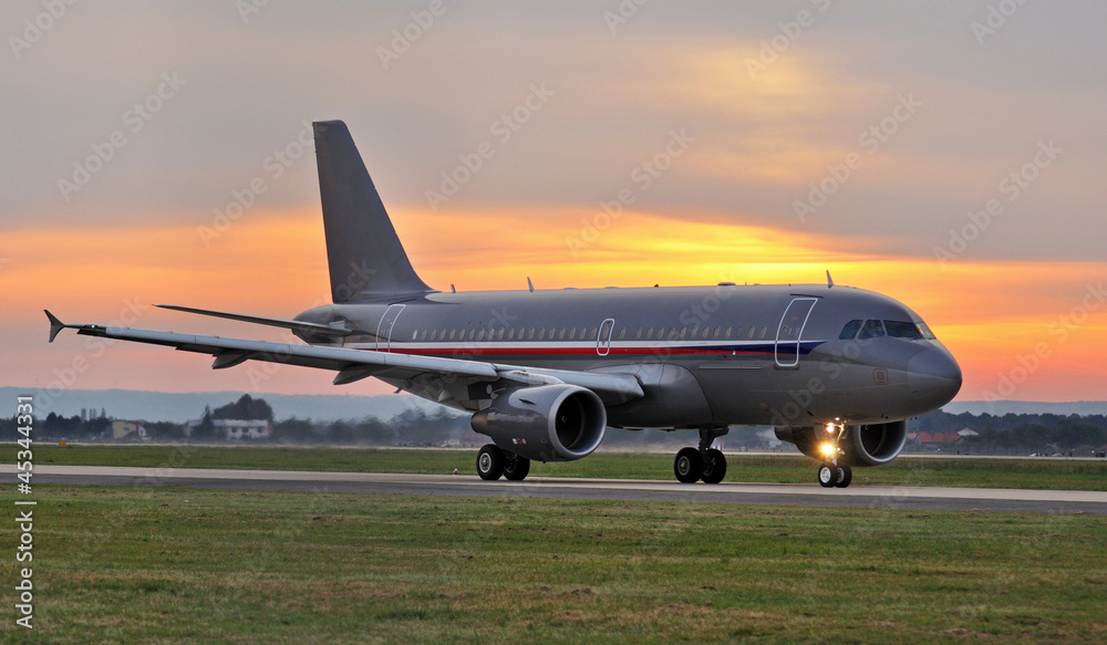 plane on the runway at sunset plane on the runway at sunset