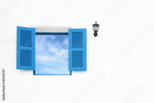 Greek Style windows and lamp with blue sky