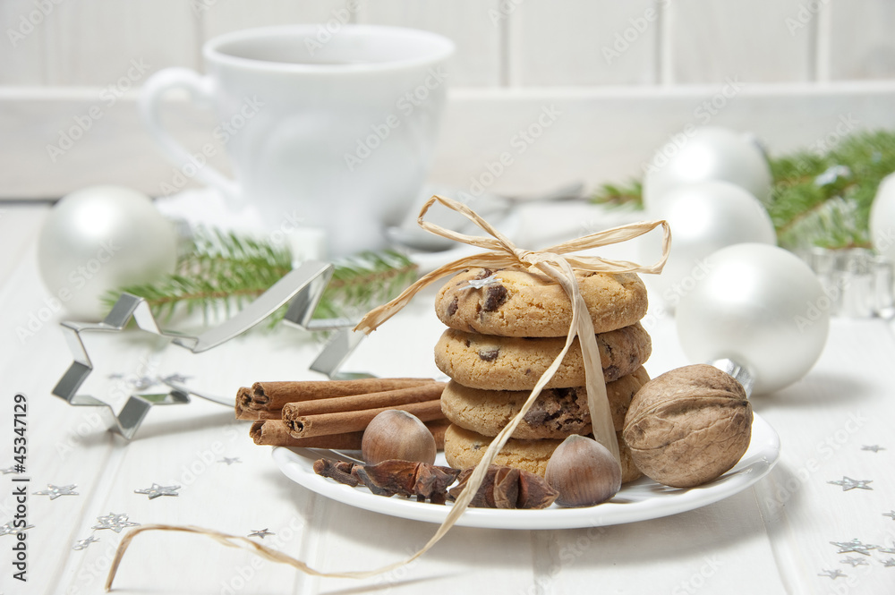 christmas still life with biscuits and a cut of tea