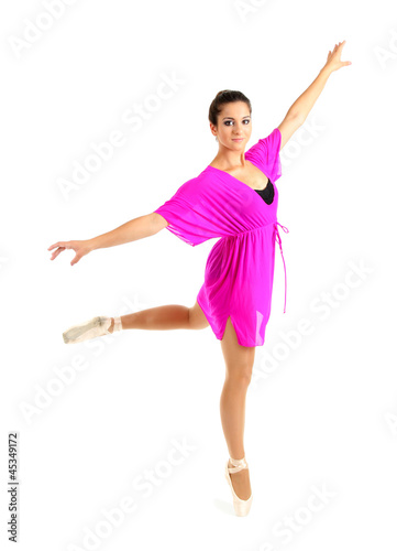 beautiful young ballerina in a pink dress isolated on white